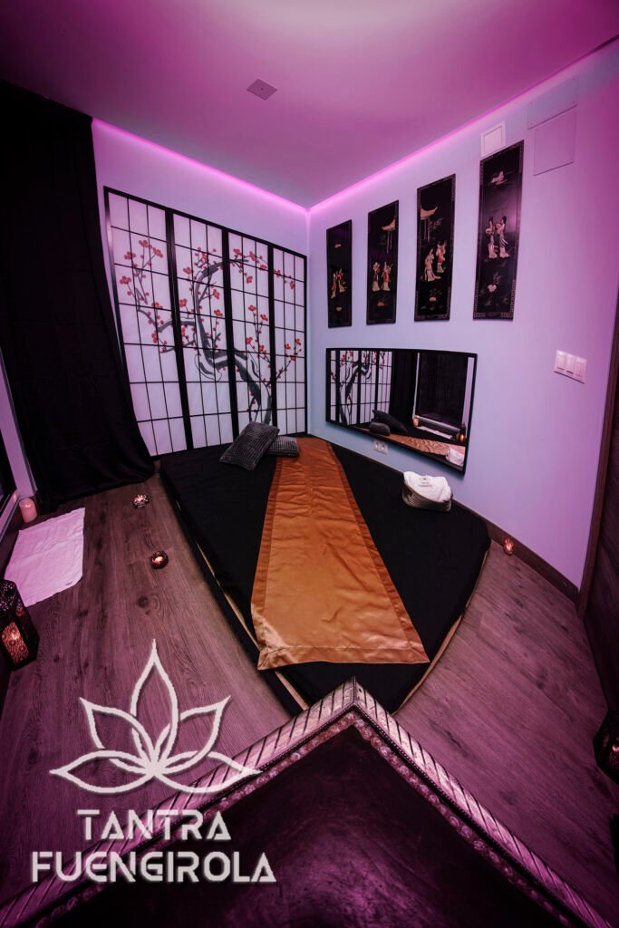 China themed private massage room with gold silk runner and shower in Fuengirola