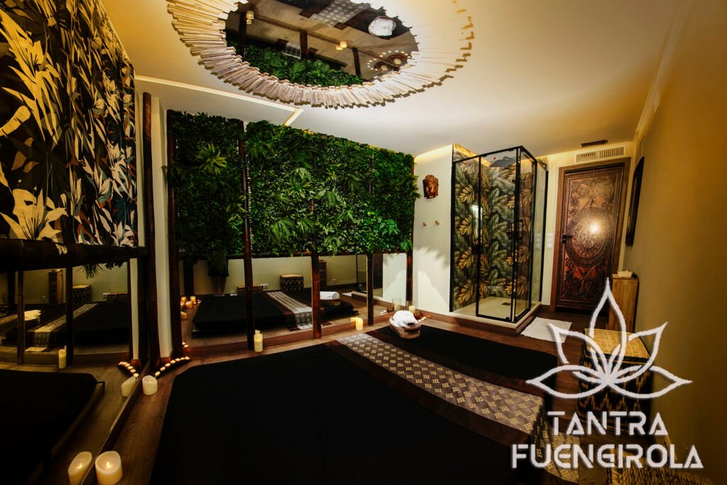 Bali themed massage room with a living plant wall and shell chandelier in Fuengirola